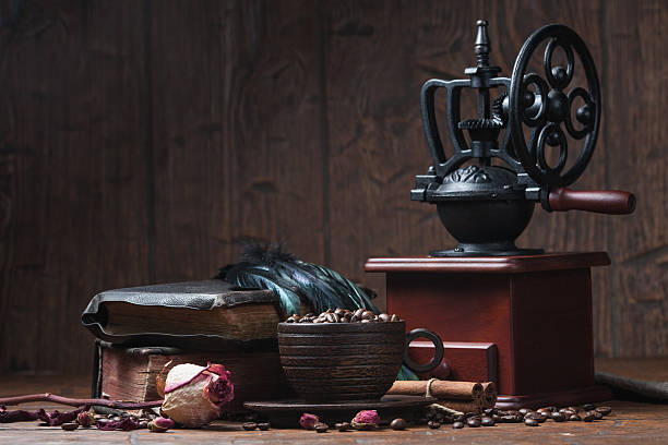 istock Cup of coffee, dry rose and grinder 608602694