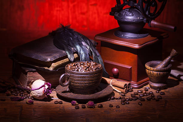 istock Cup of coffee, dry rose and grinder 608605134