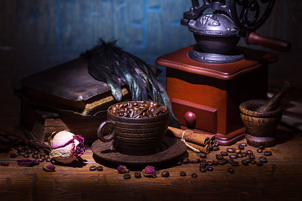istock Cup of coffee, dry rose and grinder 608605694