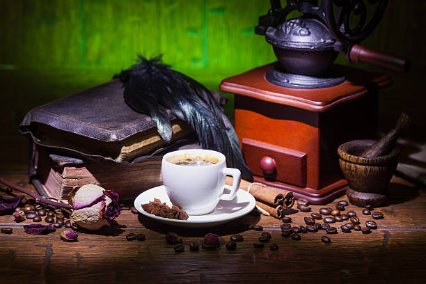istock Cup of coffee, dry rose and grinder 608606292