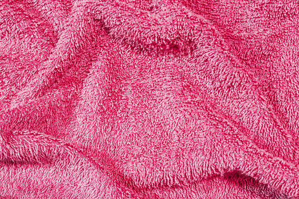 istock Closeup surface old and wrinkled red fabric towel texture background 608607840