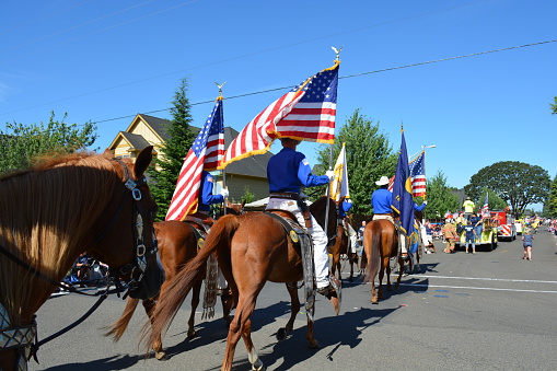 Portland, United States - July 4, 2012: Men on horse parade in Independence day in Portland, Oregon