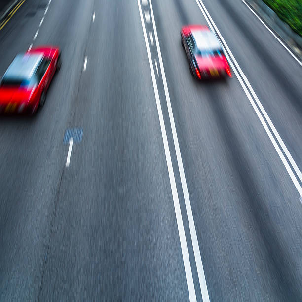 istock cars driving on highway 608615672