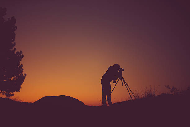 istock Photographer in the nature 608621518