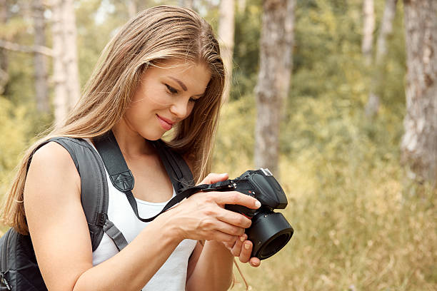 istock Female photographer on the nature 608621978
