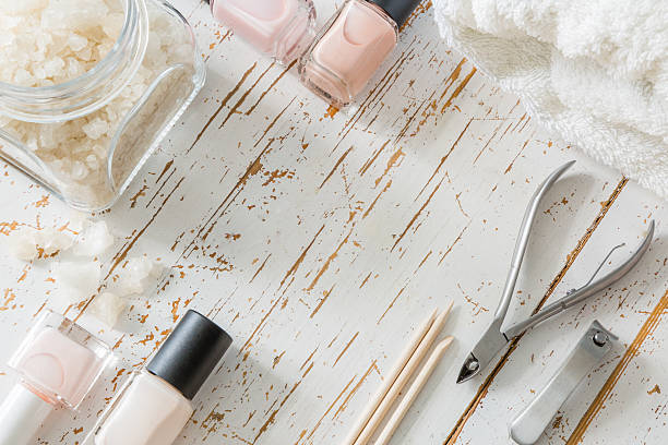 istock Selection of manicure tools on white wood background 608622022