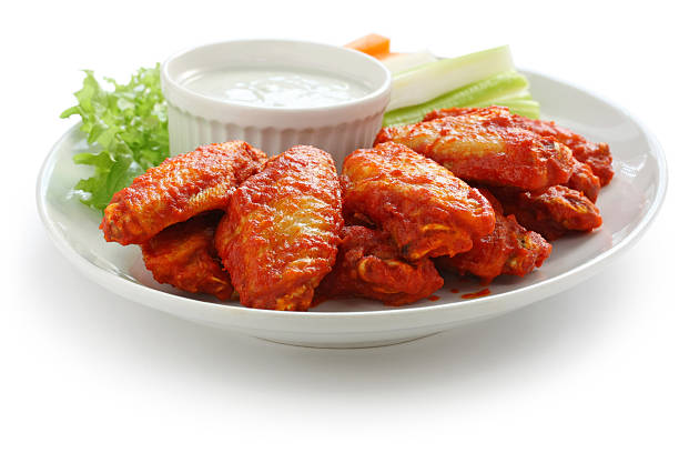 buffalo chicken wings with blue cheese dip buffalo chicken wings with blue cheese dip cayenne powder photos stock pictures, royalty-free photos & images