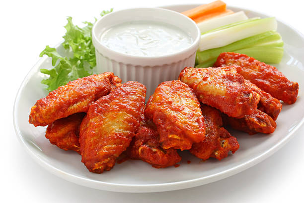 buffalo chicken wings with blue cheese dip buffalo chicken wings with blue cheese dip cayenne powder photos stock pictures, royalty-free photos & images