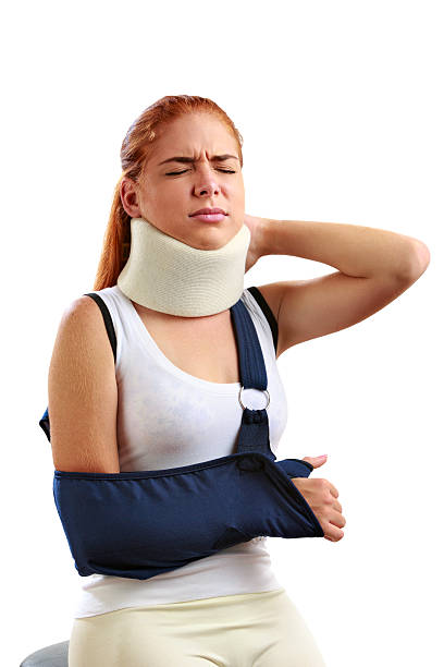 istock Young woman With Arm Sling and neck corset 608628572