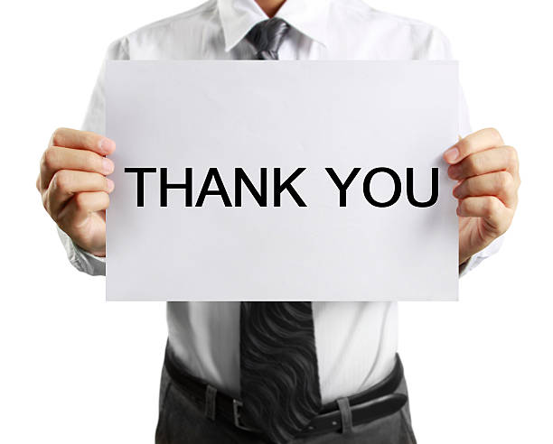 istock blank sheet of paper in  hand 608632502