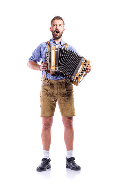 istock Man in bavarian clothes playing accordion and singing. Beer Fest 608634698