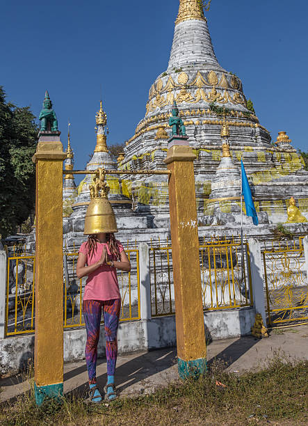 istock Backpacker traveling with backpack and looks at Buddhist stupas. Myanmar 608636108