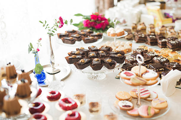 istock Delicious and tasty dessert table with cupcakes shots at reception 608637140
