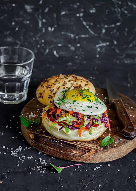 istock Homemade burger with fried egg and coleslaw 608637934
