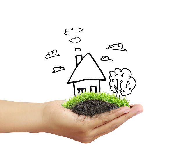 istock Business man house in  hands 608639926