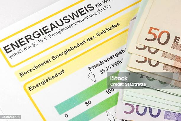 An Energy Certificate And Money Stock Photo - Download Image Now - Certificate, Currency, Document