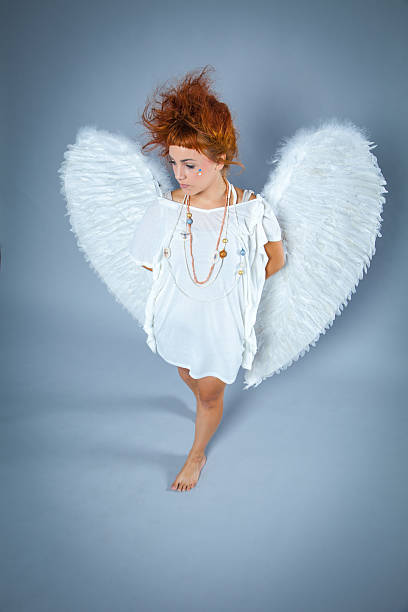 istock Red haired angel girl 609029550