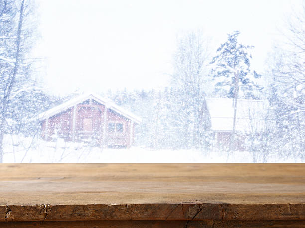 istock Empty wooden table in front of dreamy winter landscape 609033092