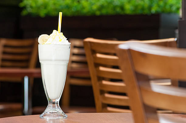 istock cold cocktail in a glass with a straw 609033262