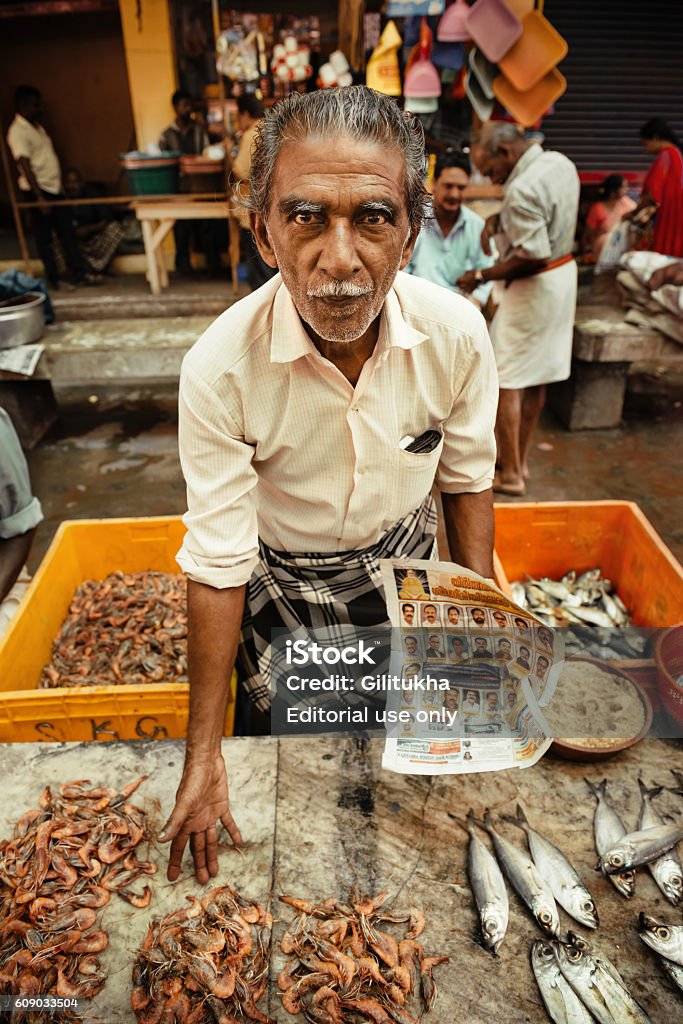 Portrait of unidentified Indian man on the fish market Varkala, India - January 29, 2016: Closeup portrait of unidentified local Indian man on the fish market Puthanchanda, Kerala state Adult Stock Photo