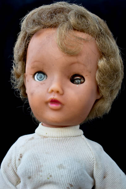 istock Close Up and Isolated Vintage Antique Old Doll 609035104