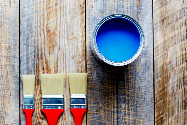 istock painting with can blue paint on wooden background 609035868