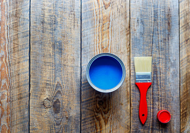 istock painting with can blue paint on wooden background 609035954