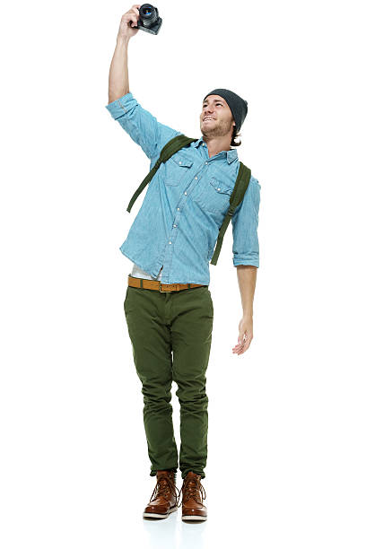 Smiling photographer taking a selfie