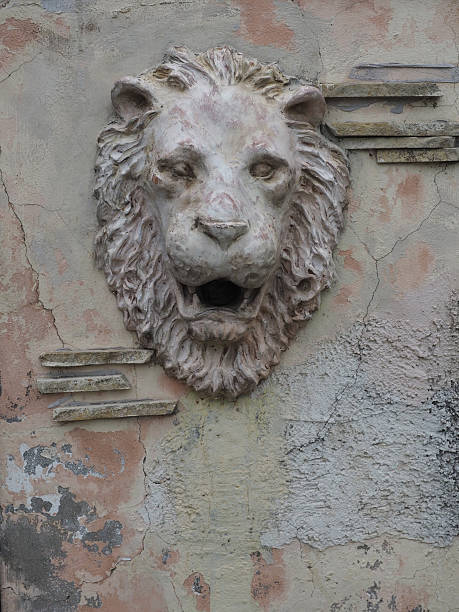 istock lion's head on the wall. architectural detail 609038710
