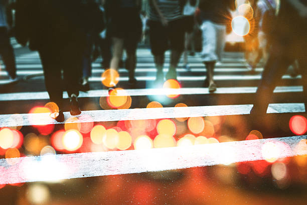 nyc commuters crossing the street in double exposure