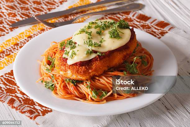 Chicken Parmigiana And Pasta With Tomatoes Closeup Stock Photo - Download Image Now