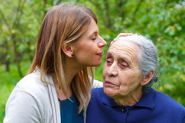 istock Kissing grandma's forehead 609047034