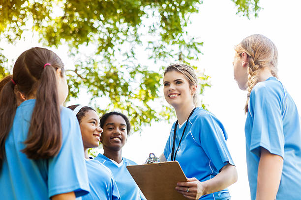 istock Soccer coach talking to soccer team during practice 609049234