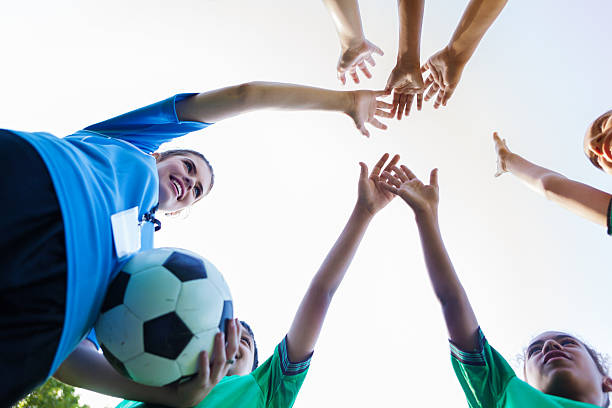 istock Group of diverse teammates on soccer team huddle together 609049256