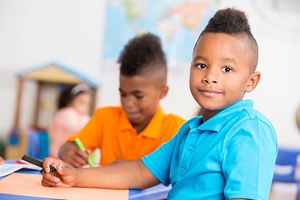 istock Handsome African American boy has fun in class 609050110