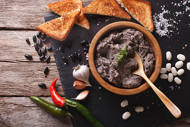 istock Frijoles refritos with ingredients close-up. Horizontal top view 609050238