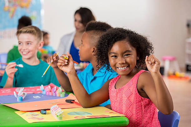 istock Young African American girl has fun creating artwork 609050296