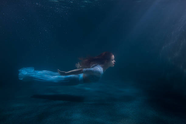 istock Woman as the mermaid under water. 609053082