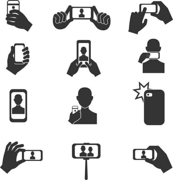 Selfie photo vector icons set Selfie photo vector icons set. Photography with use smartphone and stick illustration hand holding phone white background stock illustrations