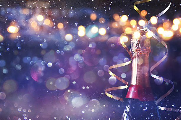 Abstract image of champagne bottle and festive lights