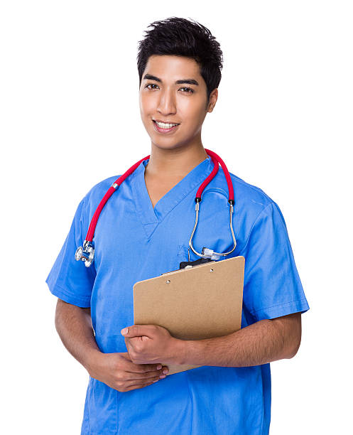 istock Male doctor holding clipboard 609054772