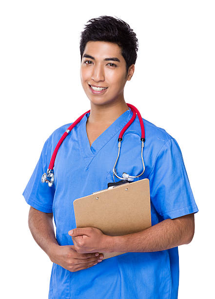 istock Male doctor holding clipboard 609054812