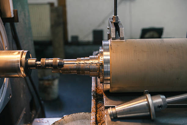 istock metal parts on lathe 609054996