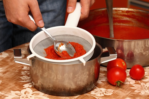 Tomatoes boiled to mush pressed through the strainer