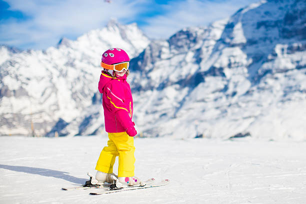 istock Little child skiing in the mountains 609056400