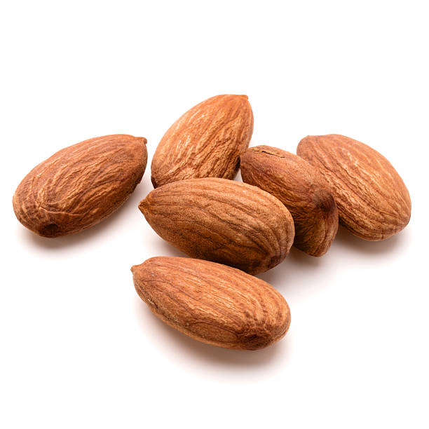 istock almond nuts isolated on white background close up 609056736