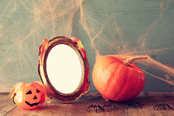 istock Halloween concept. pumpkin next to blank photo frame 609057522