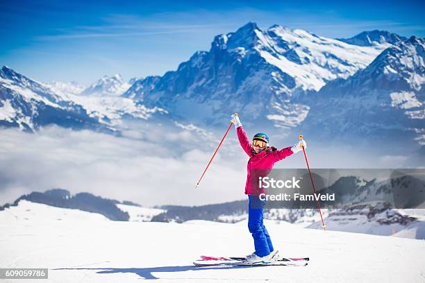 Young Active Woman Skiing In The Mountains Stock Photo - Download Image Now - Skiing, Ski, Women