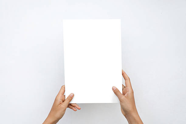 istock Closeup Blank White Paper Sheet Mockup Holding Female Hands Abstract 609060104