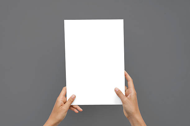 istock Closeup Blank White Paper Sheet Mockup Holding Female Hands Abstract 609060176